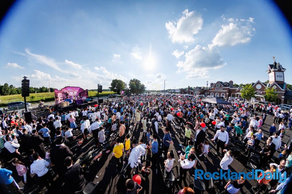 A huge outdoor crowd at a Dirnfeld Brothers show